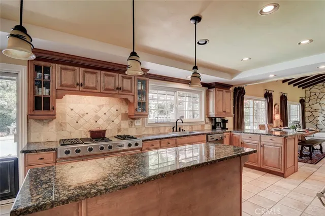 a living room with furniture a rug and a fireplace