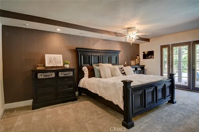 a bed room with a bed and a television