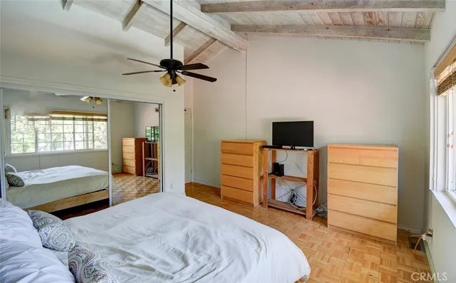 a view of a patio with table and chairs potted plants