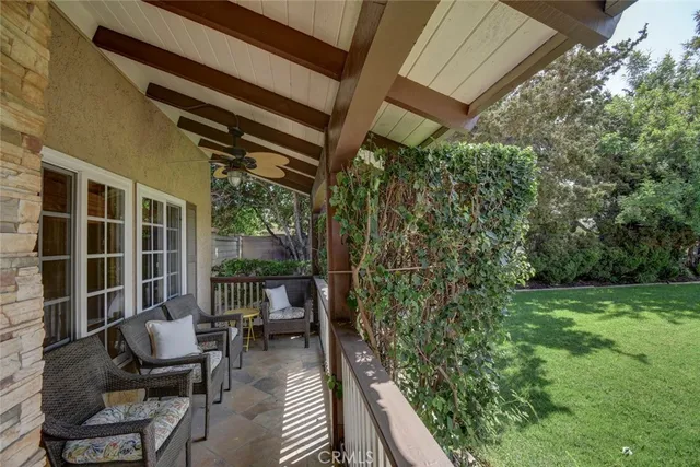 a view of a chairs and table in patio with wooden floor