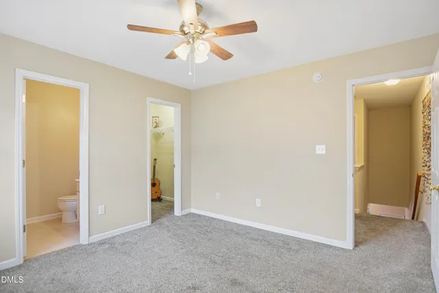 a view of an empty room and closet area