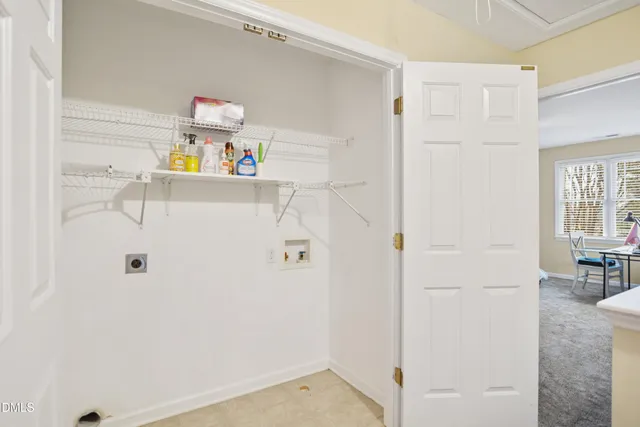 a bathroom with a refrigerator and a sink
