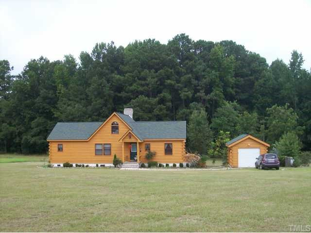 493 McGee Road Benson, NC 27504 - Photo 1 of 12 Dream home built with love for a warm, welcoming retreat. 2 + acres plus an additional 8.15 acres perfect for enjoying nature, privacy, yet so convenient to shopping, schools and restaurants. Exterior Front