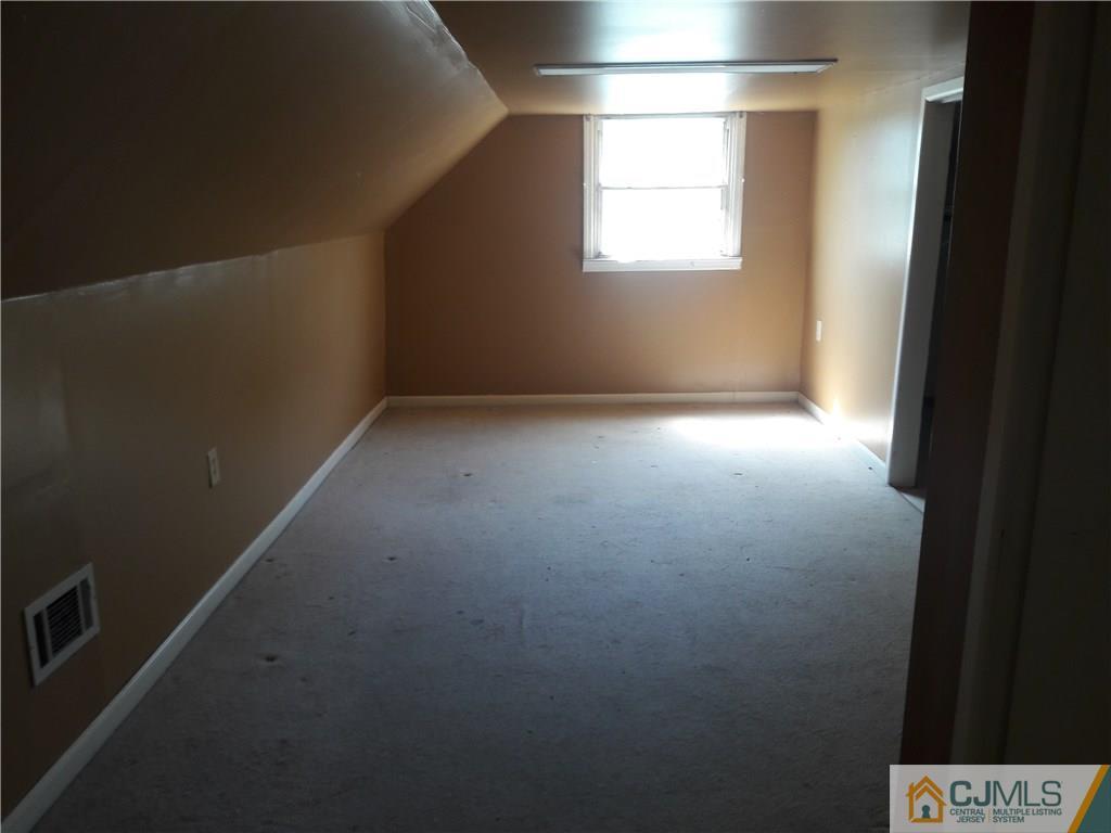 4 Sine Road Edison, NJ 08817 - Photo 14 of 25 a view of an empty room with a window