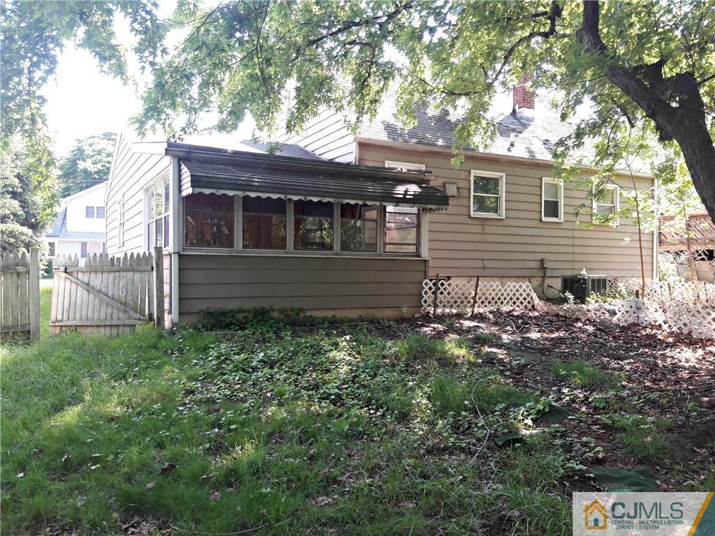 4 Sine Road Edison, NJ 08817 - Photo 22 of 25 a backyard of a house with lots of green space