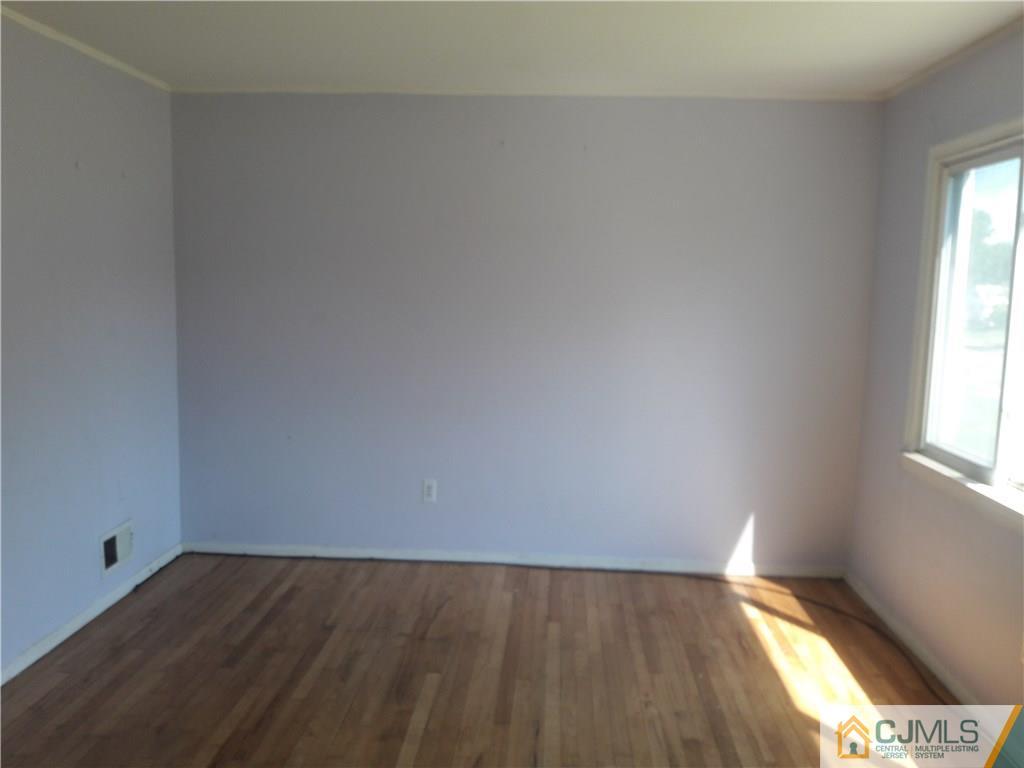 4 Sine Road Edison, NJ 08817 - Photo 4 of 25 a view of an empty room and window
