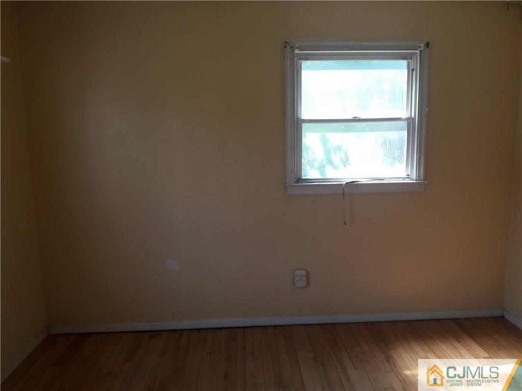 4 Sine Road Edison, NJ 08817 - Photo 7 of 25 an empty room with a window