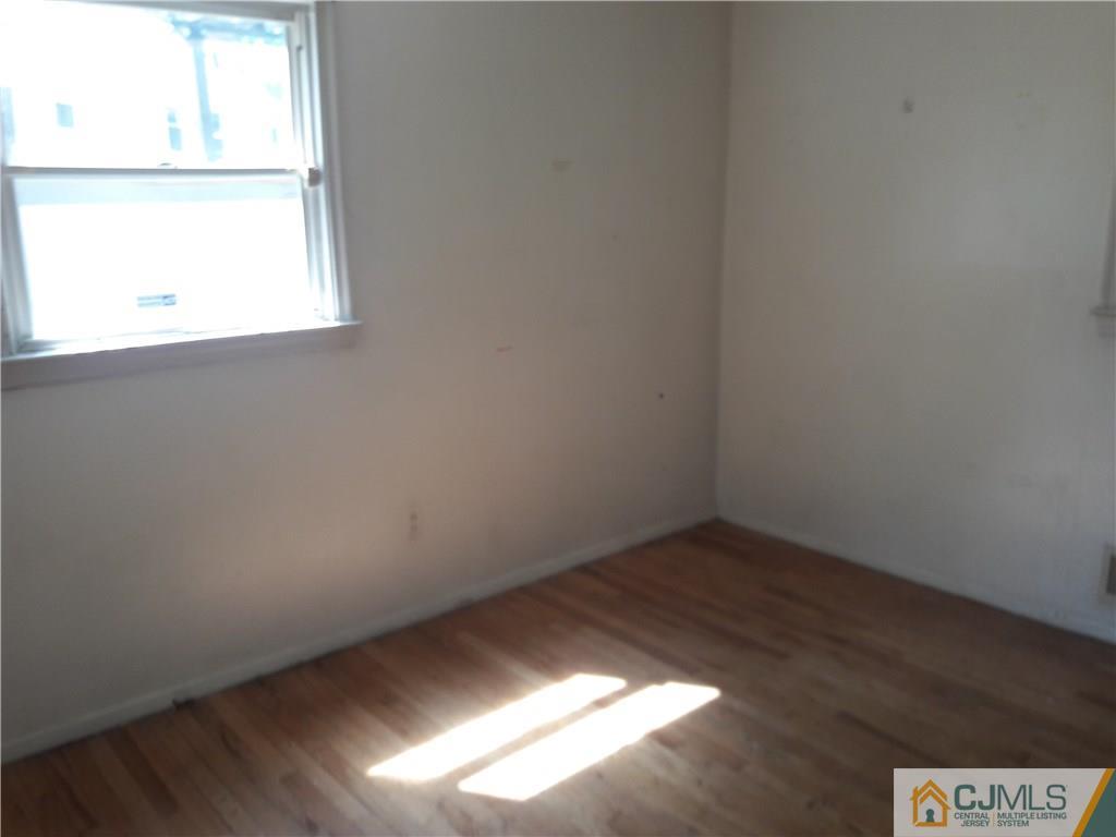 4 Sine Road Edison, NJ 08817 - Photo 8 of 25 a view of an empty room and window