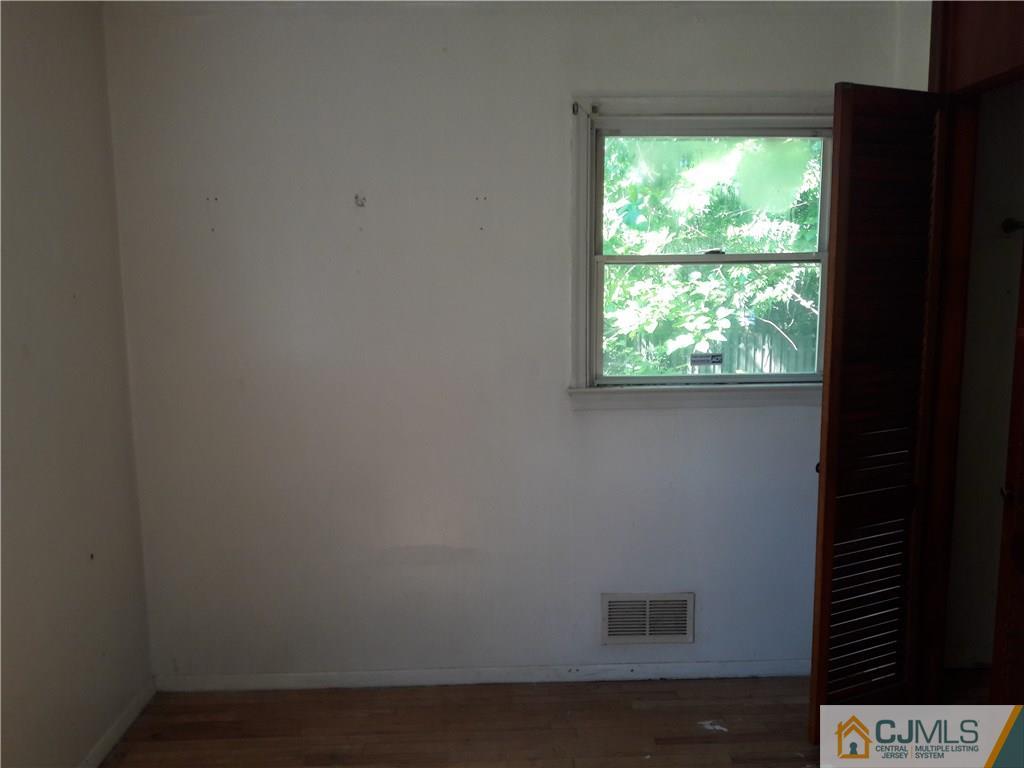 4 Sine Road Edison, NJ 08817 - Photo 9 of 25 a view of an empty room with a window