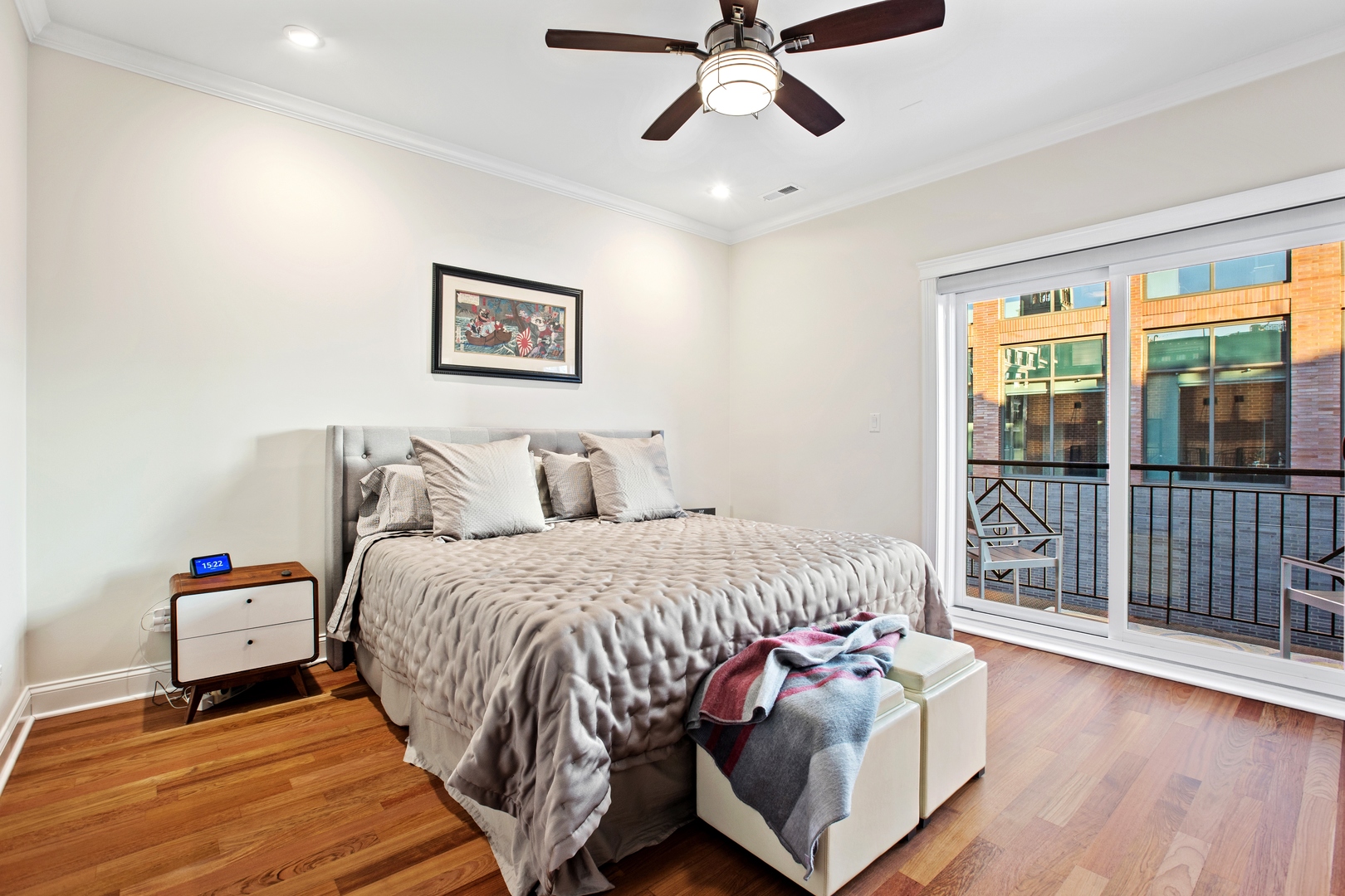 39 North Morgan Street, Unit 4 Chicago, IL 60607 - Photo 13 of 24 a bedroom with a bed and wooden floor