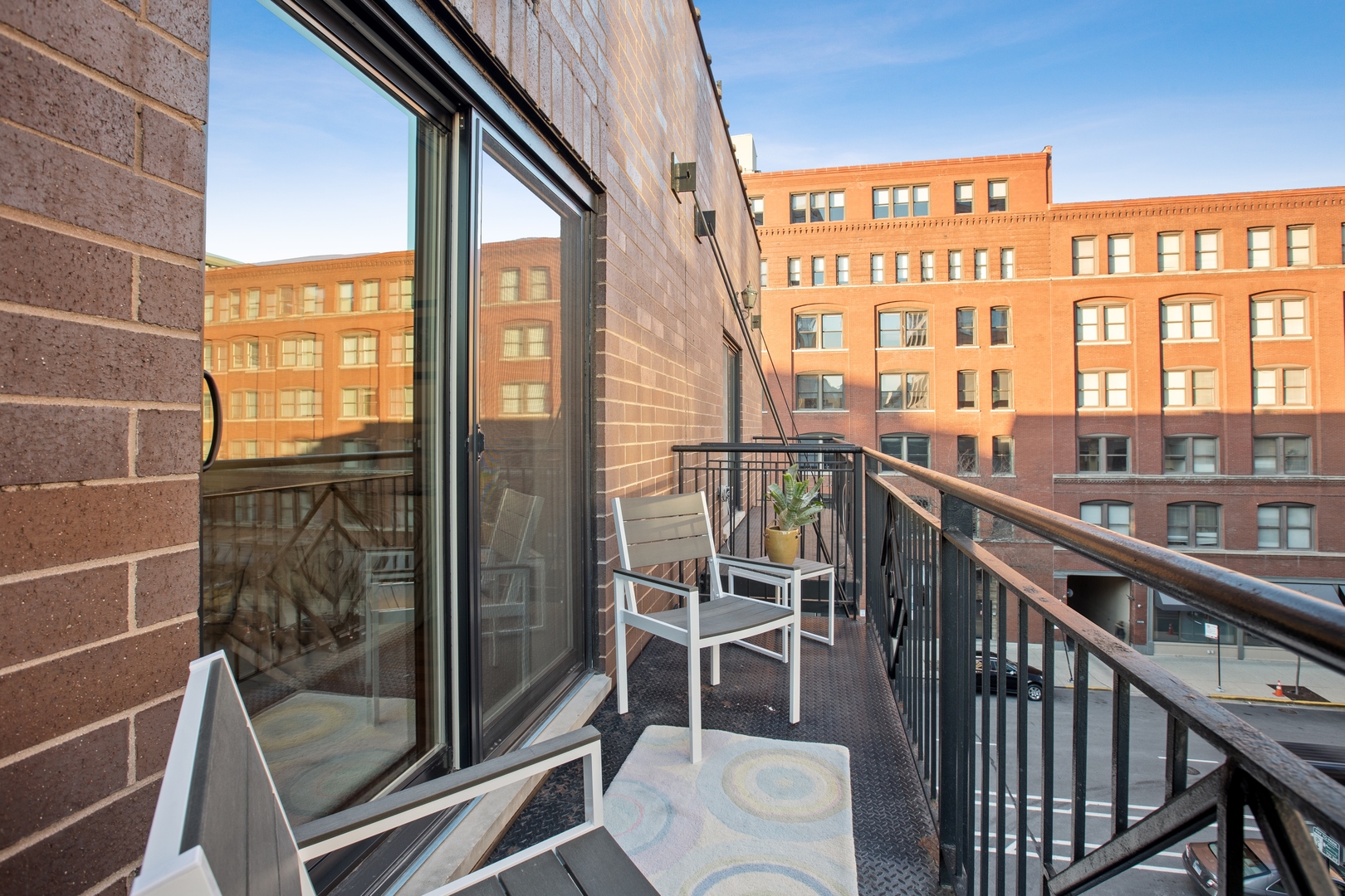 39 North Morgan Street, Unit 4 Chicago, IL 60607 - Photo 18 of 24 a view of a balcony with chairs