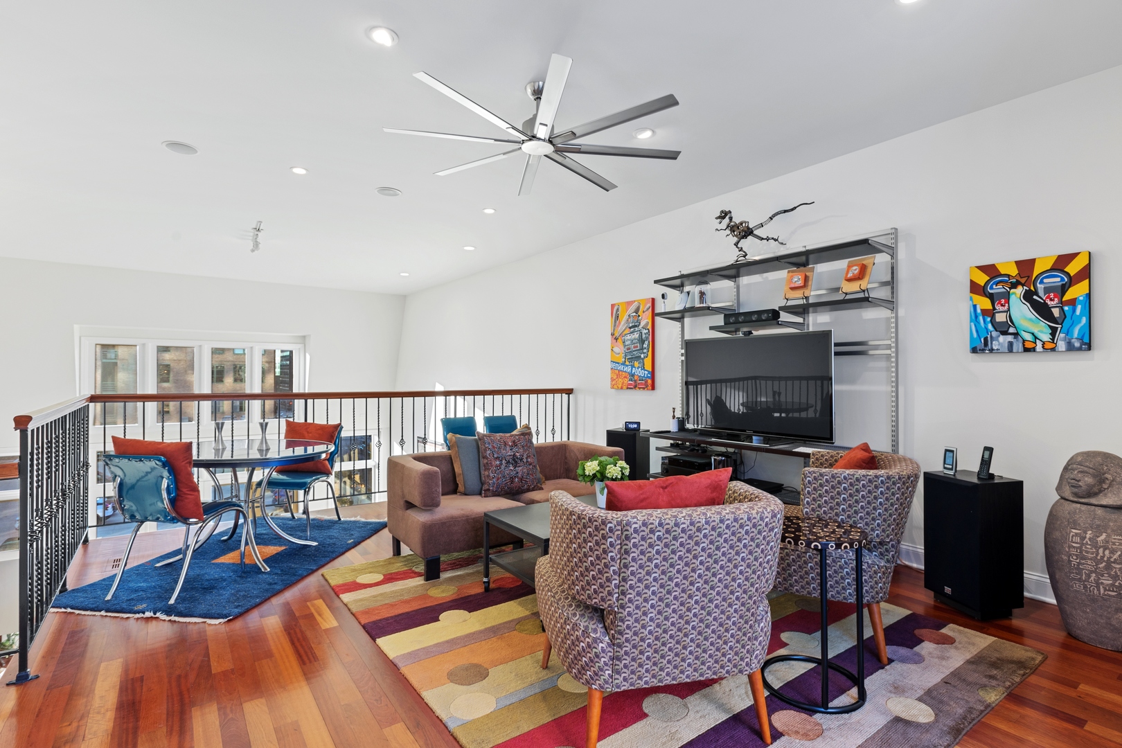 39 North Morgan Street, Unit 4 Chicago, IL 60607 - Photo 19 of 24 a living room with furniture a rug and a flat screen tv