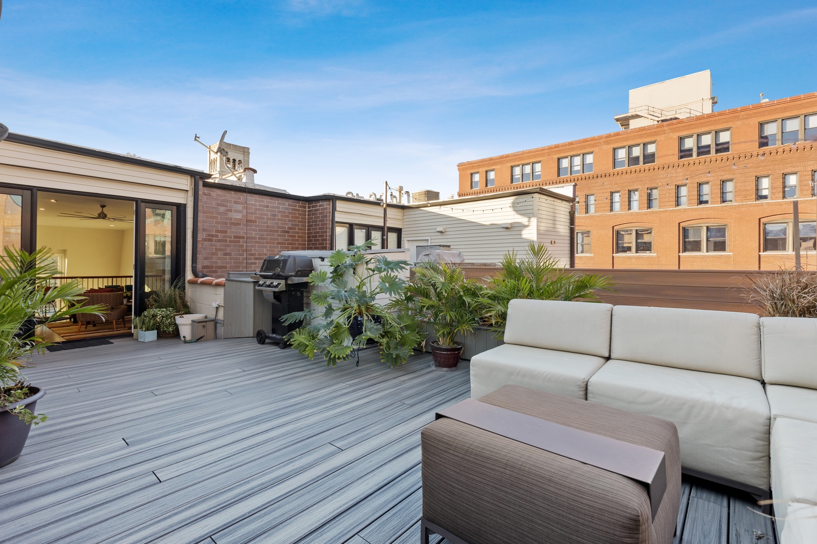 39 North Morgan Street, Unit 4 Chicago, IL 60607 - Photo 24 of 24 a view of a patio with couches and potted plants