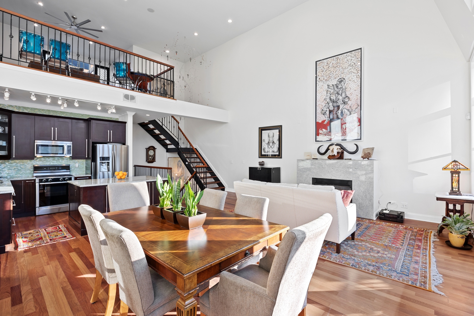 39 North Morgan Street, Unit 4 Chicago, IL 60607 - Photo 4 of 24 a view of a dining room with furniture a rug and wooden floor