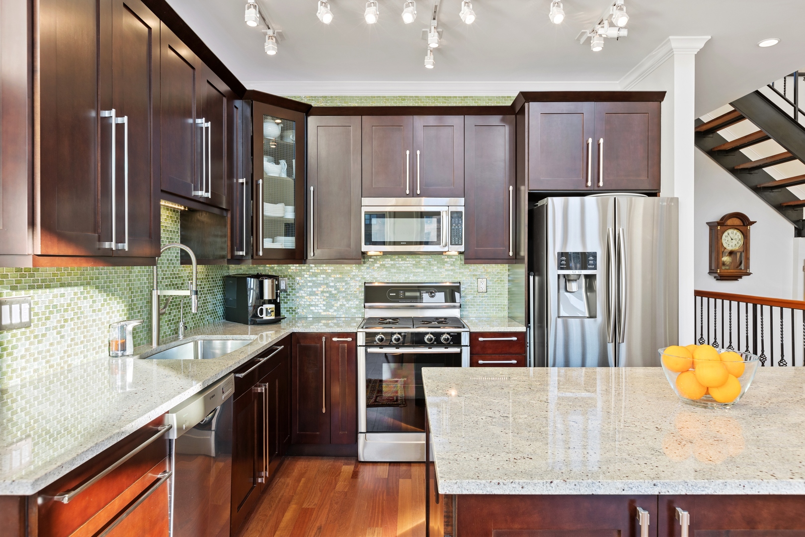 39 North Morgan Street, Unit 4 Chicago, IL 60607 - Photo 7 of 24 a kitchen with stainless steel appliances granite countertop a refrigerator a stove top oven a sink and dishwasher