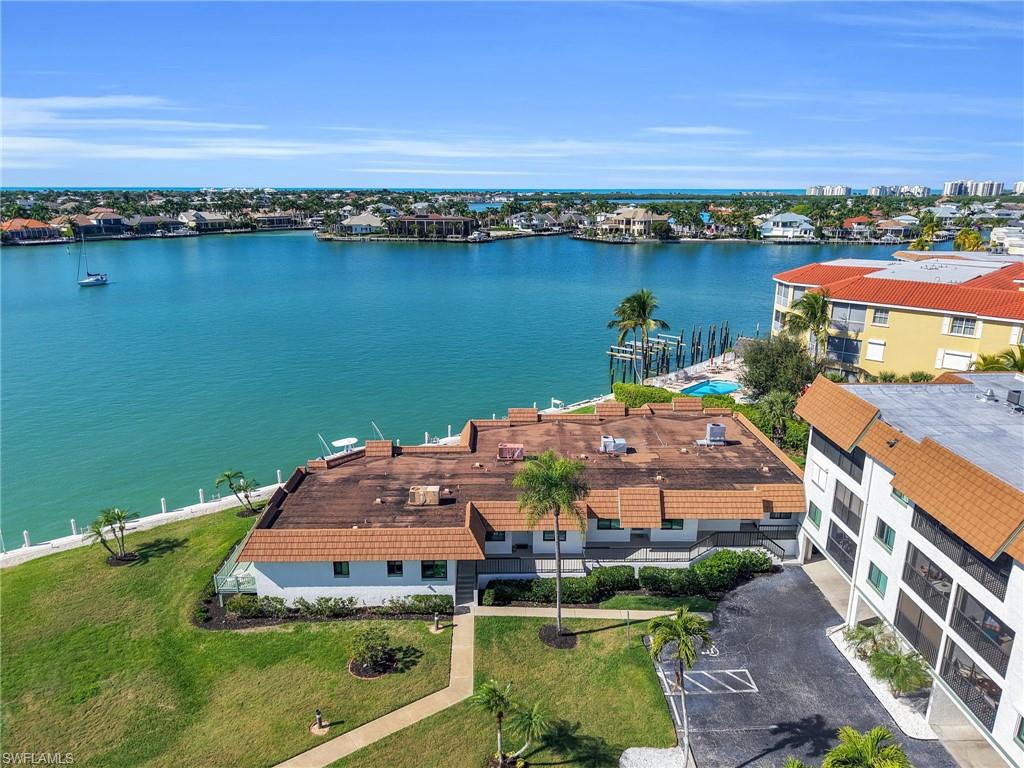 750 West Elkcam Circle, Unit 107 Marco Island, FL 34145 - Photo 24 of 33 Aerial view of a nearby body of water
