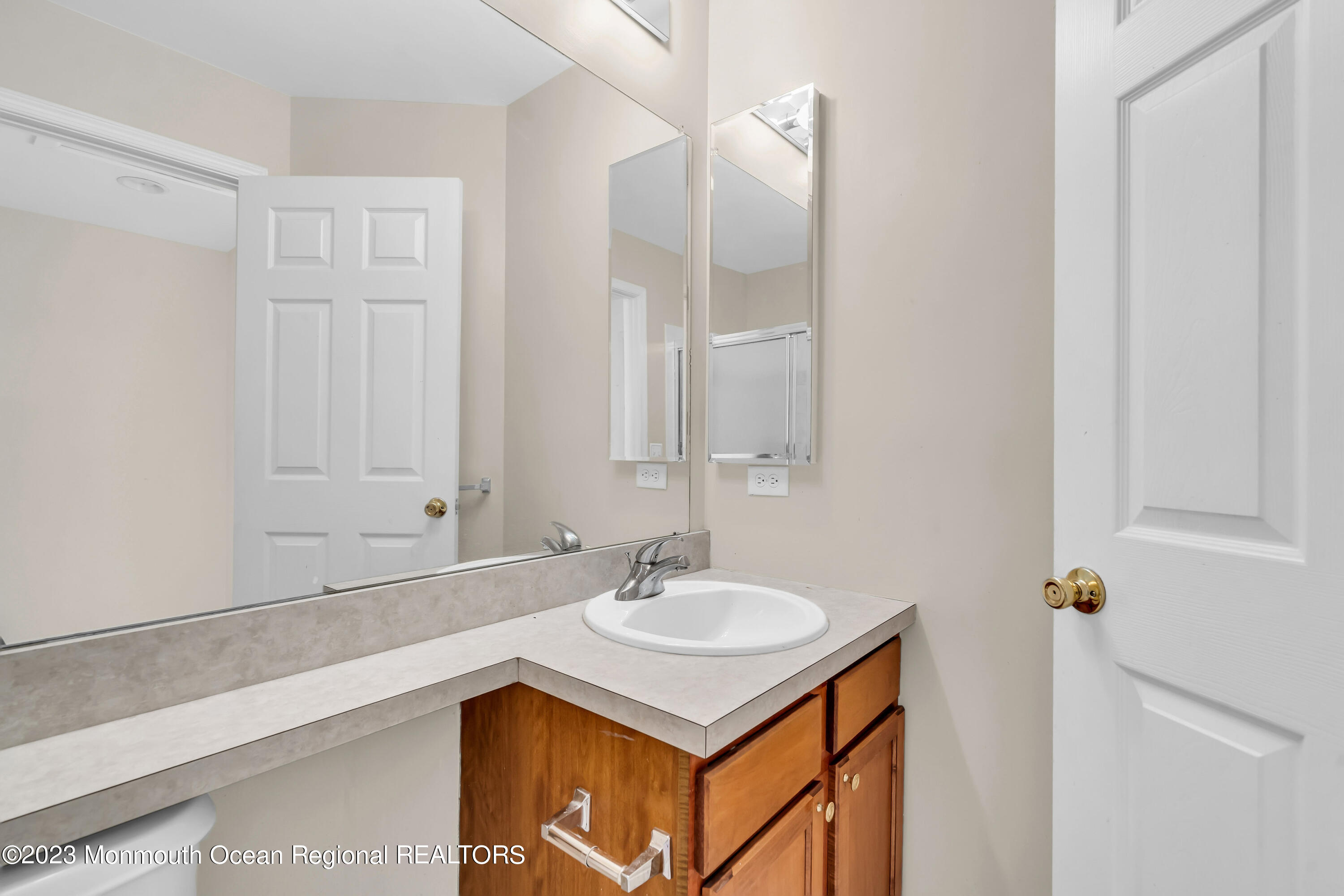 11 Kosmoski Terrace, Unit 106 Parlin, NJ 08859 - Photo 11 of 19 a bathroom with a sink and a mirror