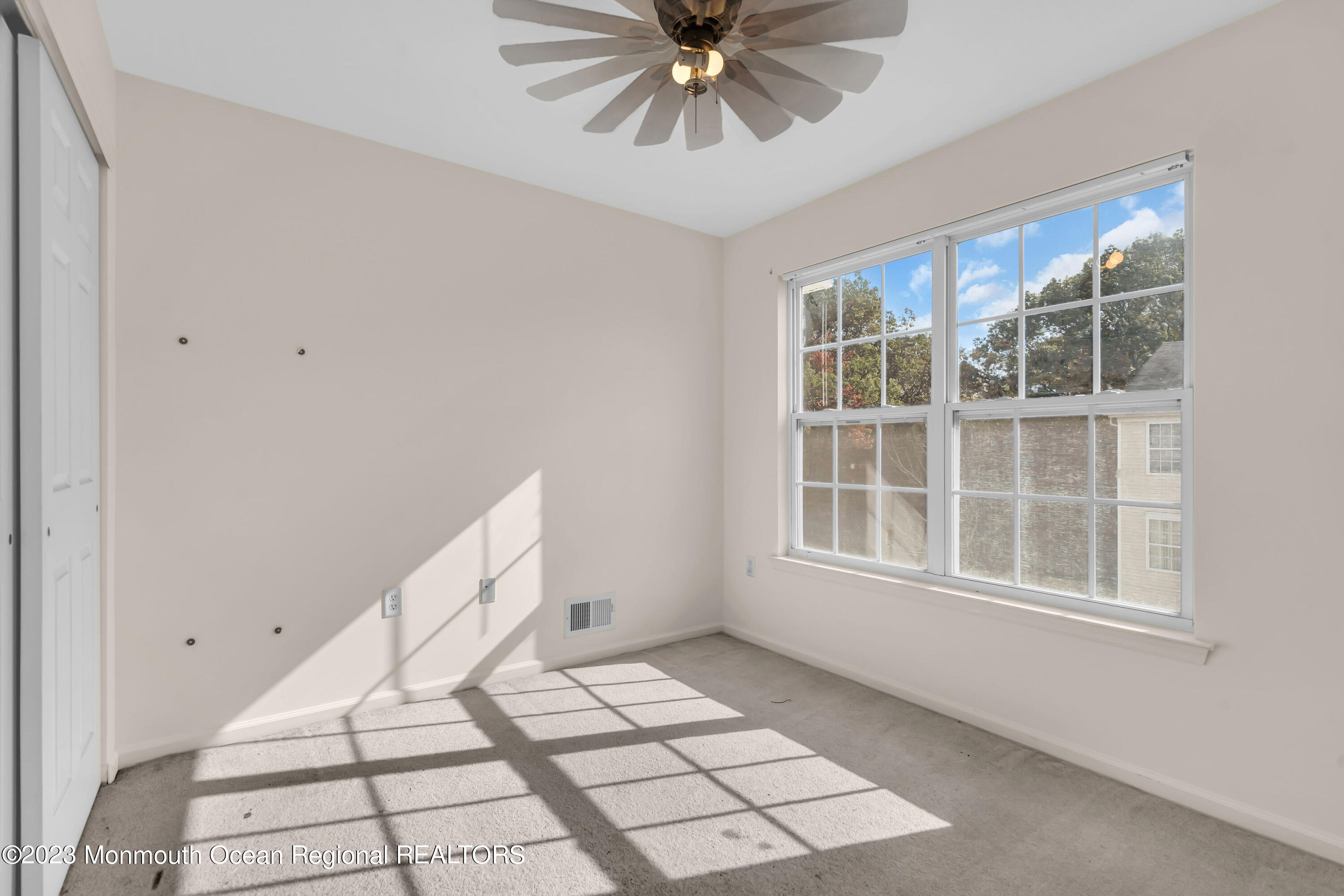 11 Kosmoski Terrace, Unit 106 Parlin, NJ 08859 - Photo 13 of 19 a view of an empty room with a window