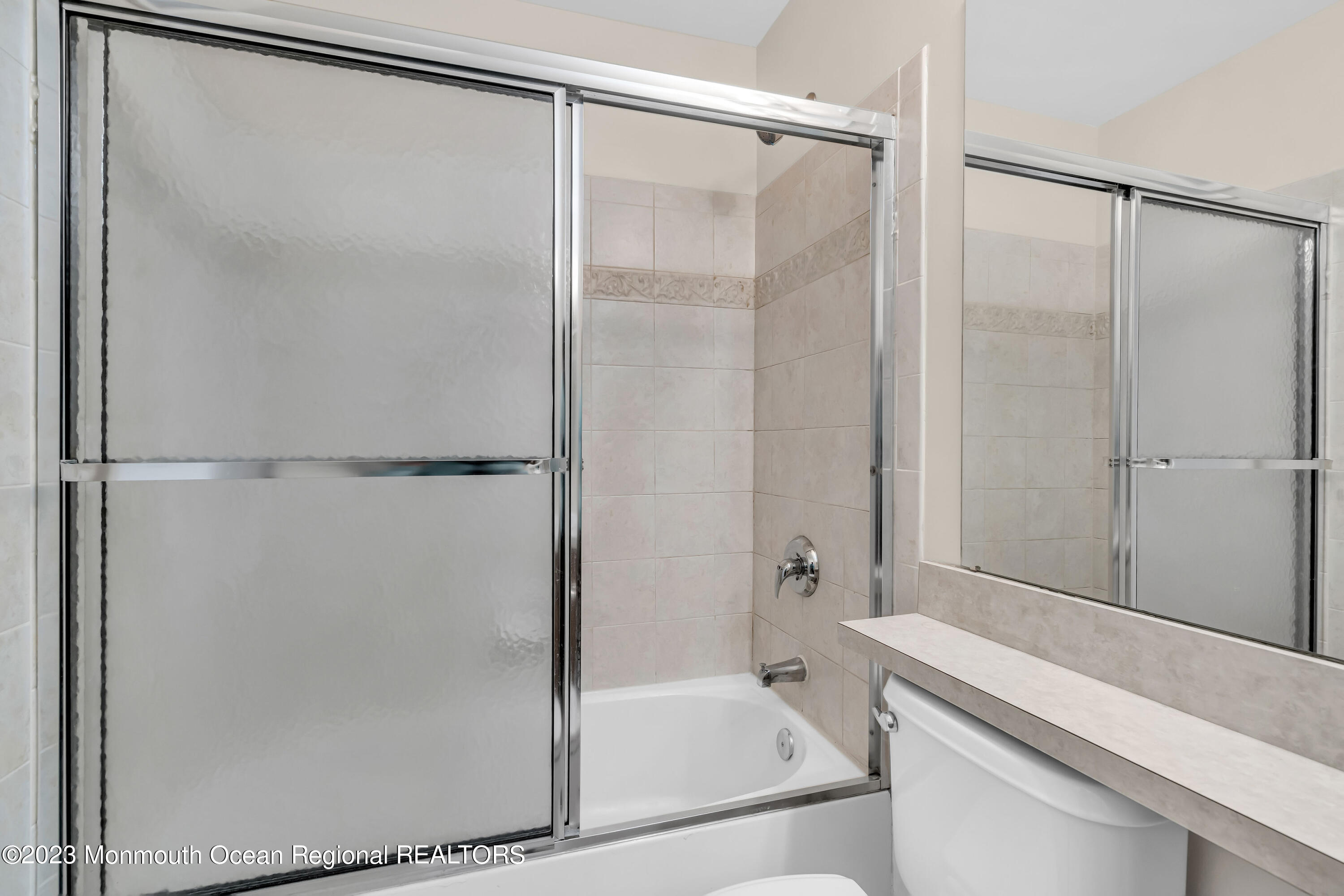 11 Kosmoski Terrace, Unit 106 Parlin, NJ 08859 - Photo 14 of 19 a bathroom with a bathtub and a shower