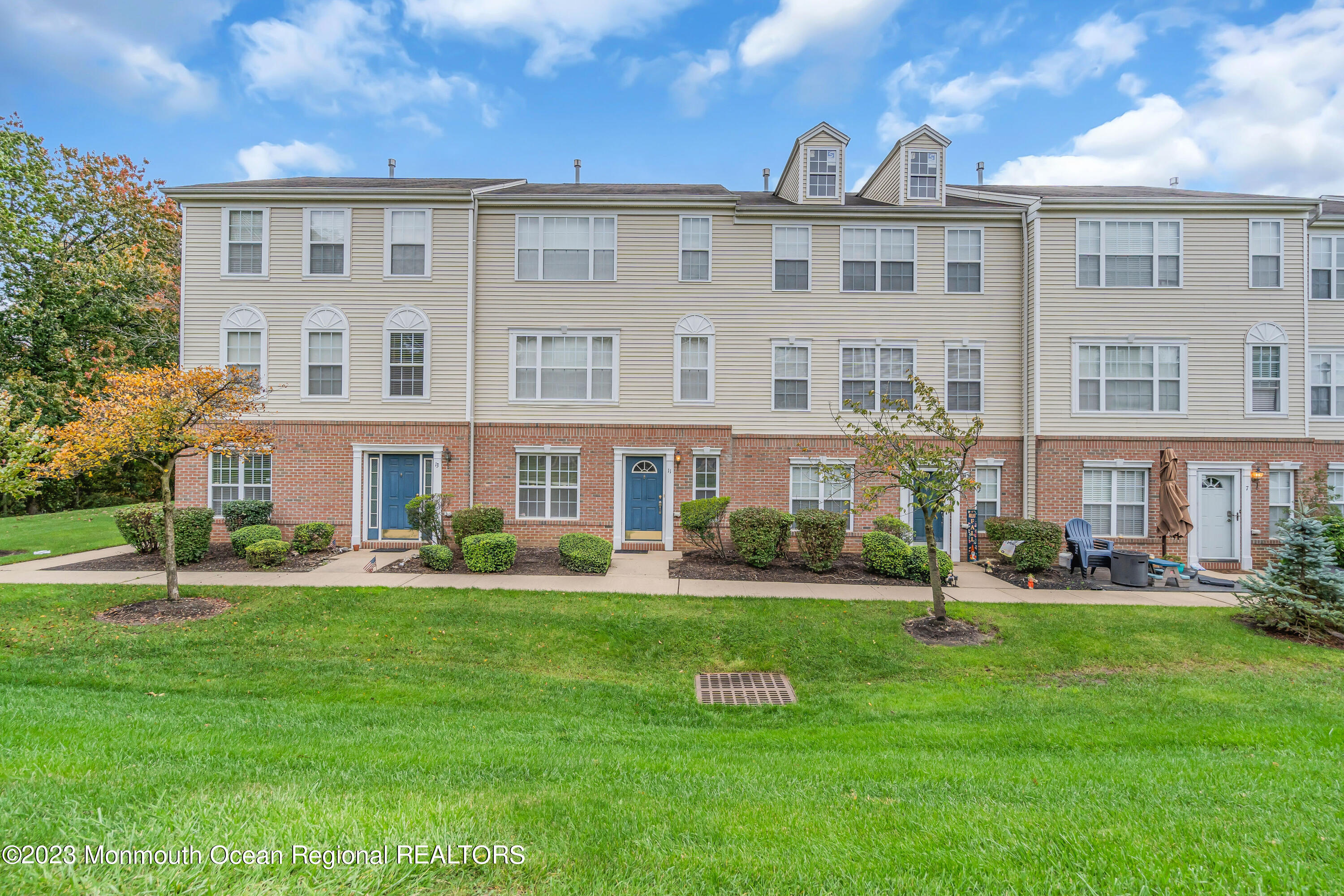11 Kosmoski Terrace, Unit 106 Parlin, NJ 08859 - Photo 19 of 19 a front view of a building with a garden