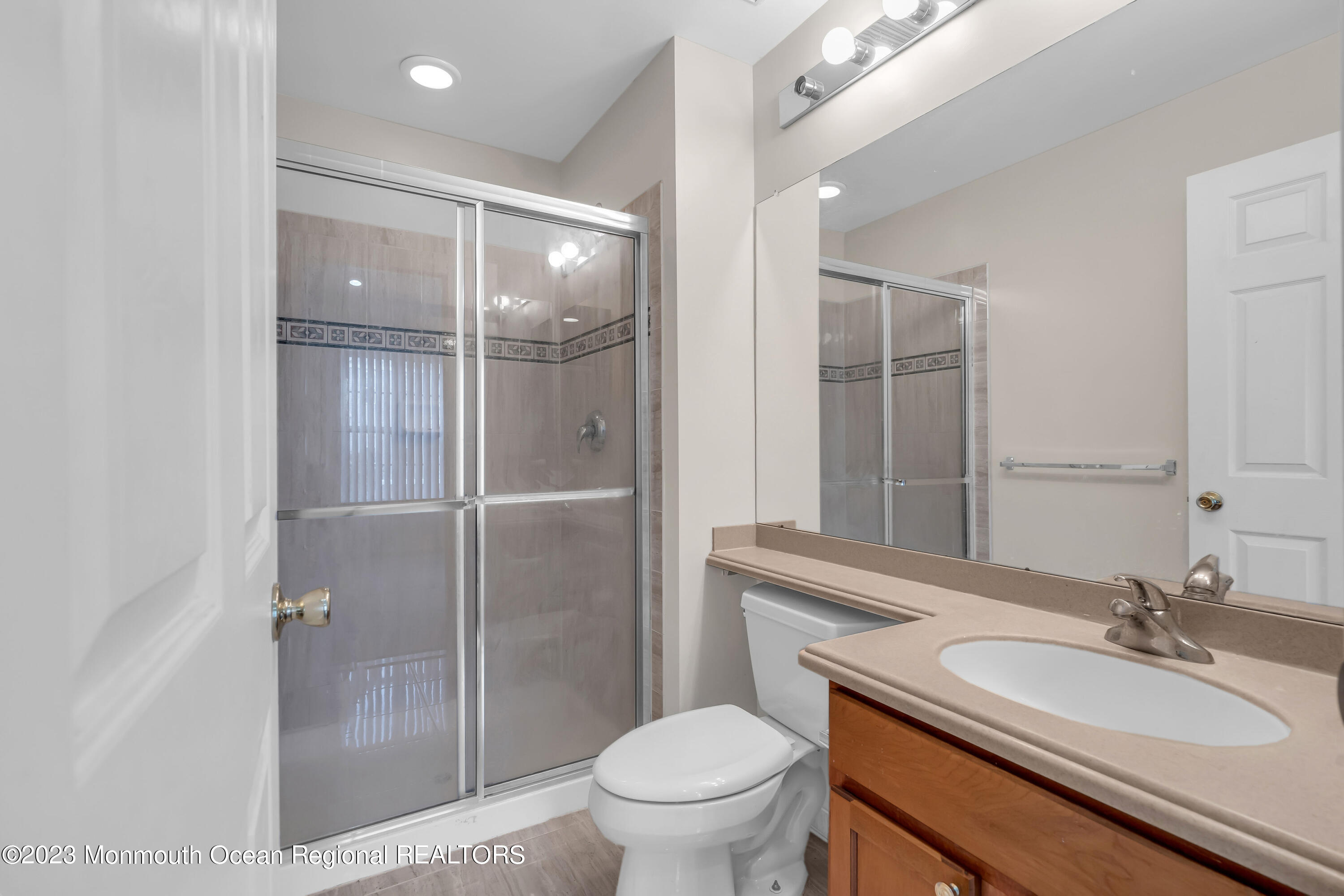 11 Kosmoski Terrace, Unit 106 Parlin, NJ 08859 - Photo 10 of 19 a bathroom with a sink a toilet and shower