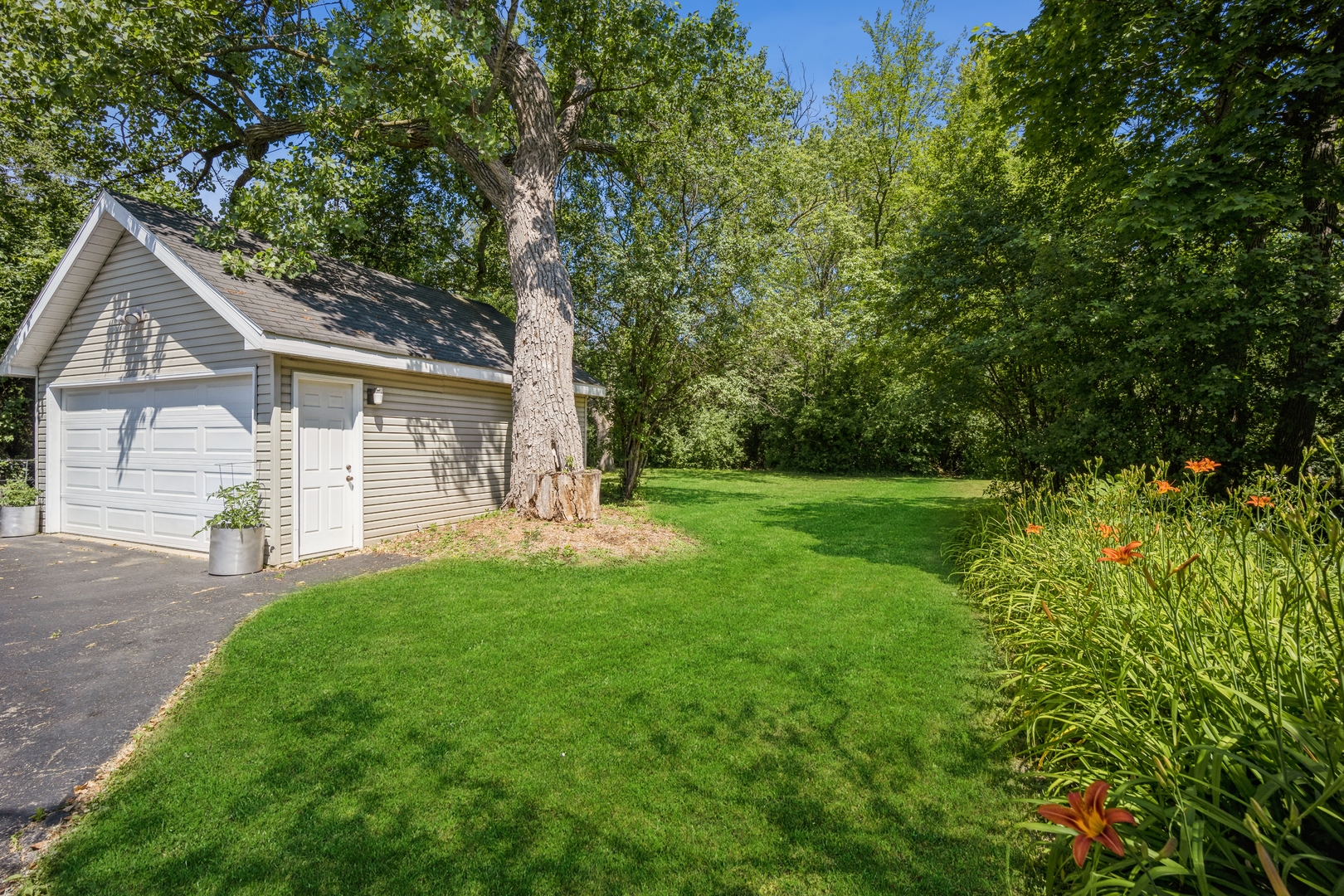 1008 Shermer Road Northbrook, IL 60062 - Photo 4 of 20 a front view of a house with yard and green space