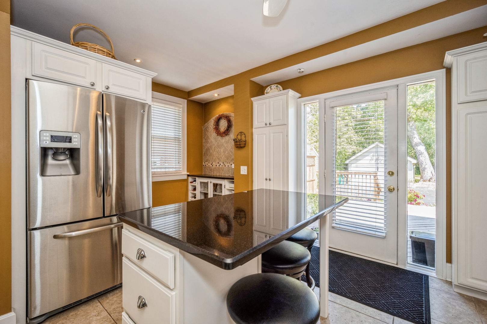 1008 Shermer Road Northbrook, IL 60062 - Photo 8 of 20 a kitchen with stainless steel appliances granite countertop a refrigerator and a stove