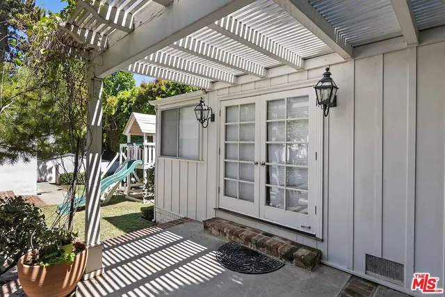 a view of a porch with wooden floor and fence