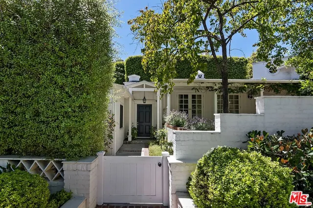 front view of a house with a garden