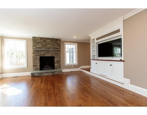 64 Chesterton Road Wellesley, MA 02481 - Photo 13 of 18 a view of an empty room with wooden floor and a fireplace