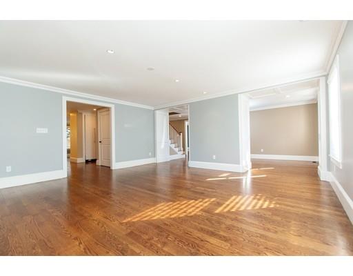 64 Chesterton Road Wellesley, MA 02481 - Photo 4 of 18 a view of an empty room with window and wooden floor