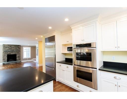 64 Chesterton Road Wellesley, MA 02481 - Photo 7 of 18 a kitchen with stainless steel appliances kitchen island granite countertop a stove a sink and a refrigerator