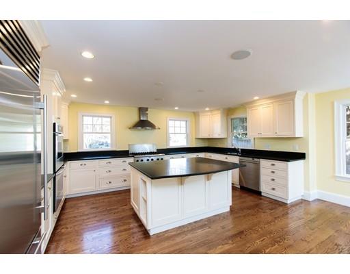 64 Chesterton Road Wellesley, MA 02481 - Photo 8 of 18 a view of a kitchen with a sink a counter top space and stainless steel appliances