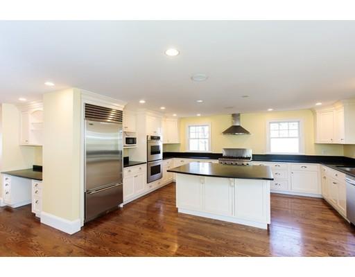 64 Chesterton Road Wellesley, MA 02481 - Photo 9 of 18 a kitchen with a refrigerator and a stove top oven