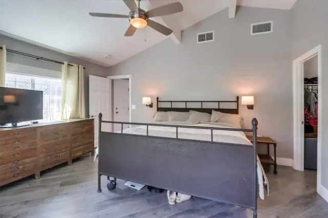 a view of room with window and wooden floor