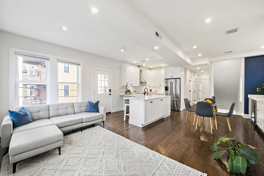 a living room with furniture white walls and white walls