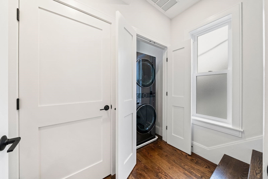 12-14 Porter Street, Unit 12 Boston, MA 02130 - Photo 21 of 37 a view of a storage and utility room with wooden floor
