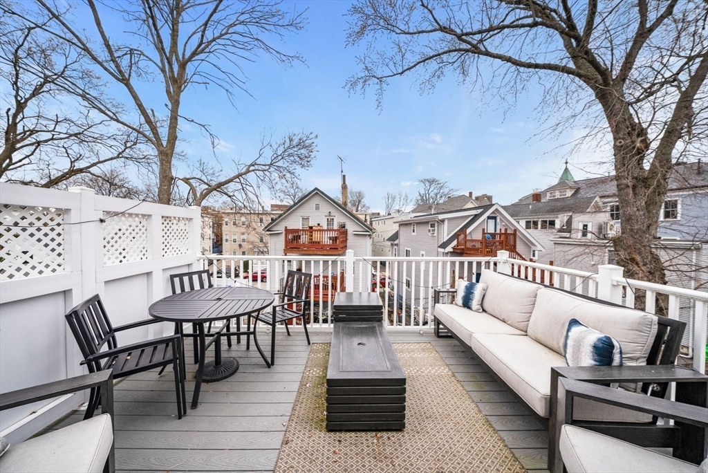 12-14 Porter Street, Unit 12 Boston, MA 02130 - Photo 31 of 37 a view of a patio with couches and a fire pit