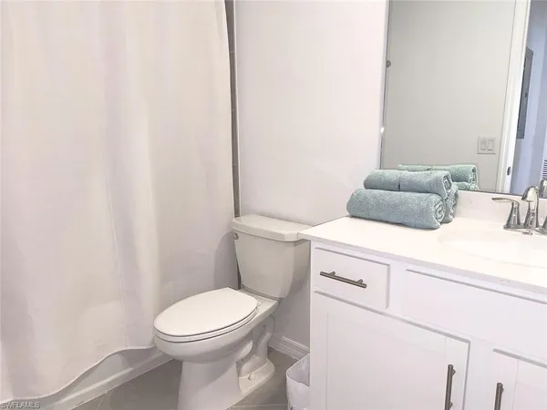a bathroom with a toilet and a sink