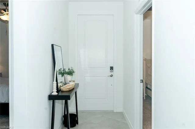 a room with table and potted plants
