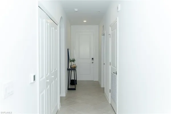 a view of a hallway with a white walls