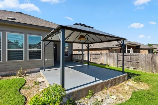 a view of a backyard with garden