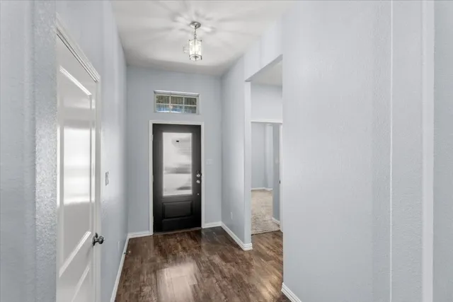 a view of livingroom with hardwood floor and hallway