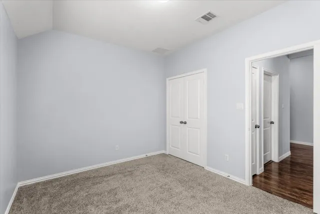 a view of hallway with wooden floor