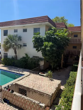 a house with trees in front of it
