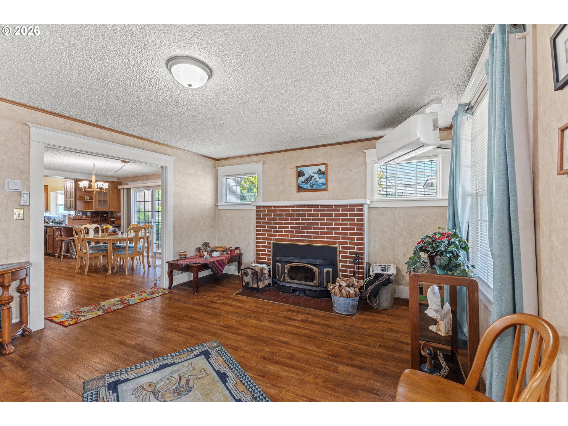 208 7th Street Myrtle Point, OR 97458 - Photo 16 of 48 a living room with furniture and a fireplace