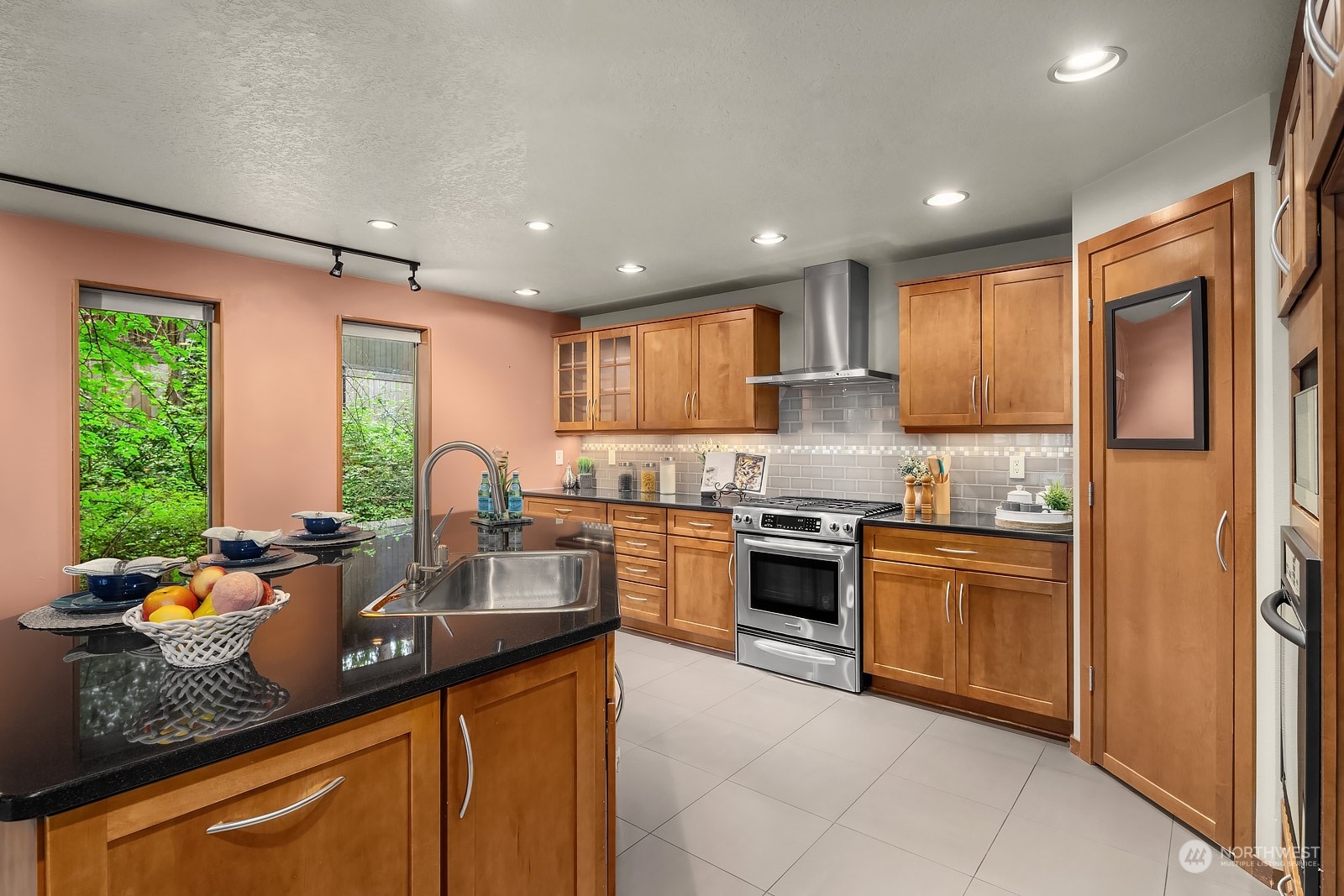16117 Southeast 145th Place Renton, WA 98059 - Photo 11 of 38 a kitchen with stainless steel appliances granite countertop sink stove top oven and cabinets