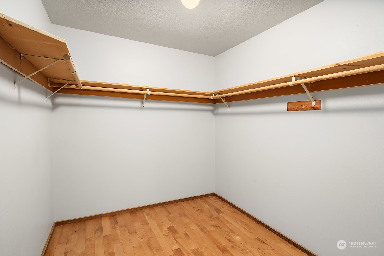 16117 Southeast 145th Place Renton, WA 98059 - Photo 20 of 38 a view of a room with racks on the wall