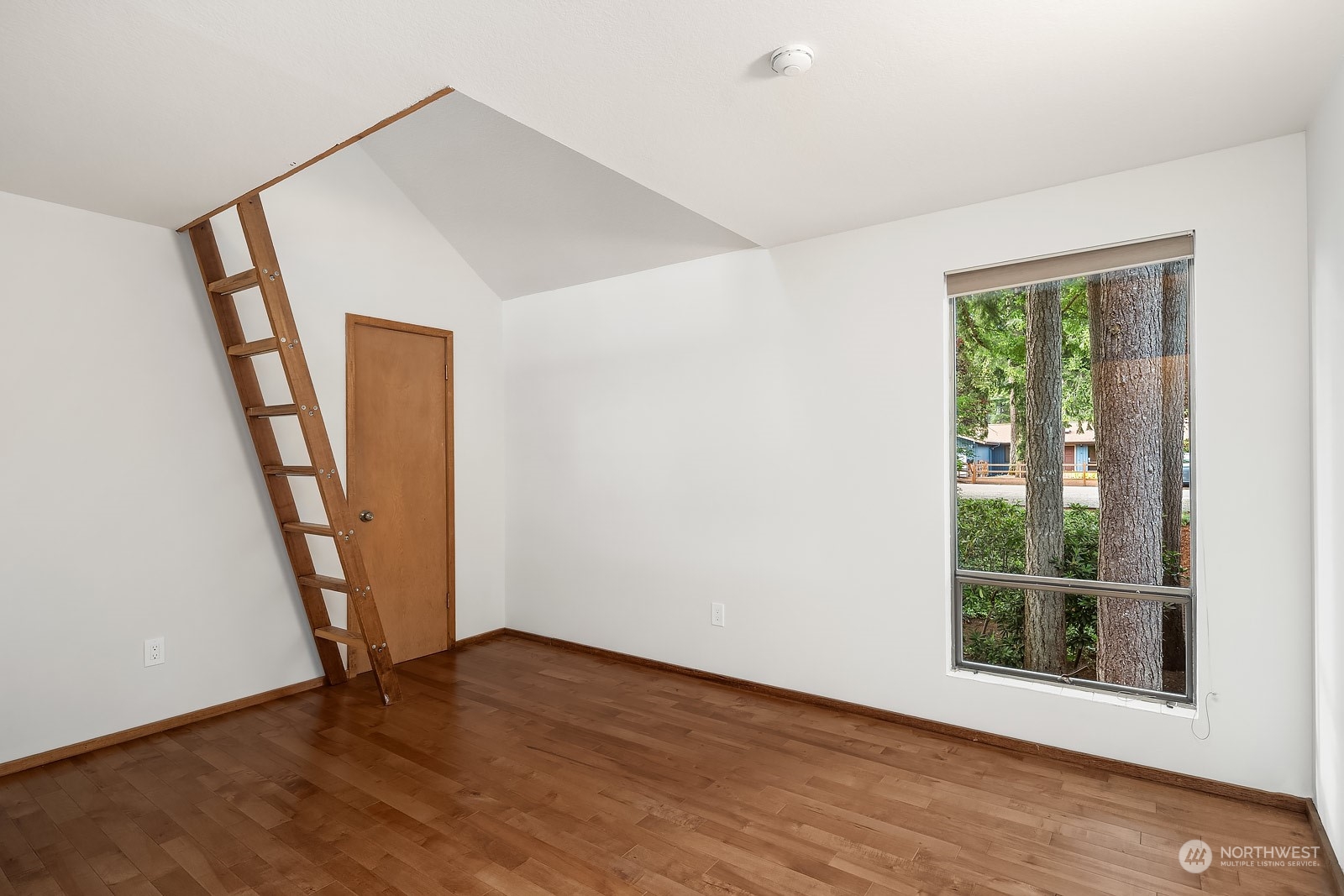 16117 Southeast 145th Place Renton, WA 98059 - Photo 21 of 38 an empty room with wooden floor and a window