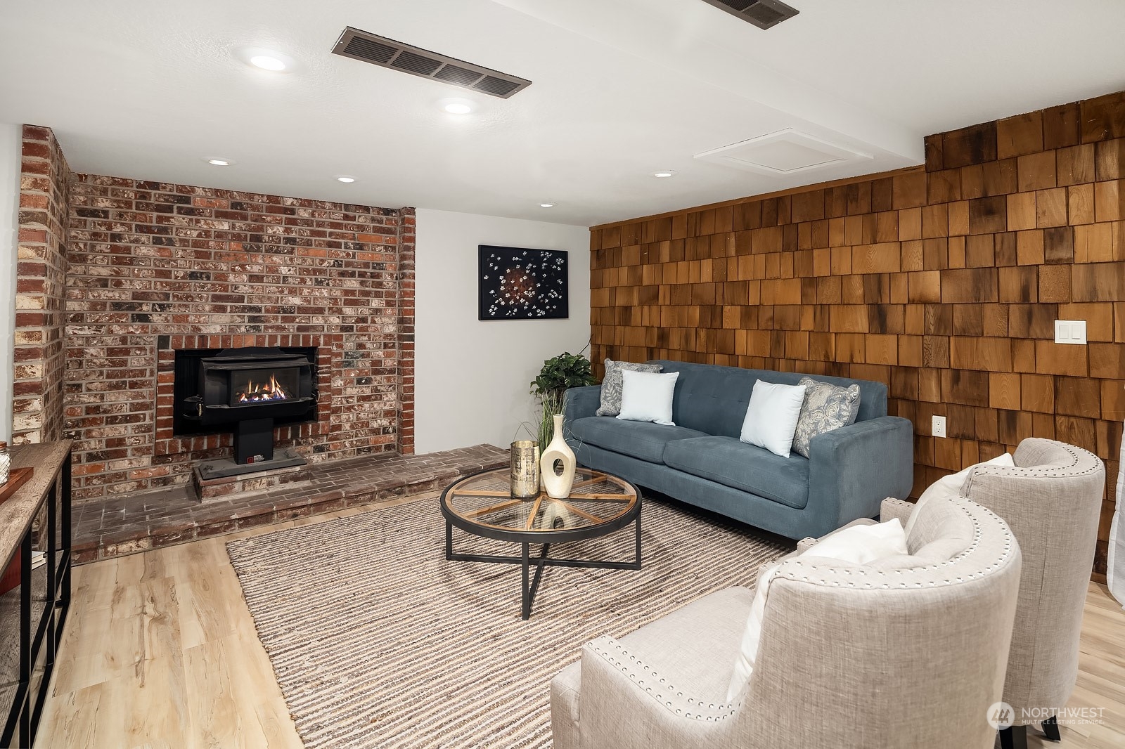 16117 Southeast 145th Place Renton, WA 98059 - Photo 25 of 38 a living room with furniture and a fireplace